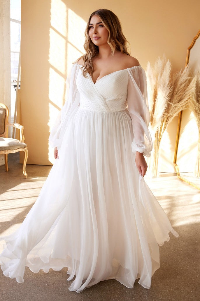 The diaphanous gown features a romantic sweetheart neckline with intricate pleating throughout framed by billowing sheer blouson sleeves that can be worn on or off the shoulder. The frothy A-line skirt is gathered at the waist and flows to a gently pooling hem. Long Sleeve Chiffon Gown (No Stretch) Sweetheart bodice with billowy sleeves Open back Floor length A-line skirt with a small train Details: Bra Cup, Fully Lined Fit: The model is 5'8" and is wearing 4" heels