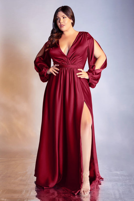 Elegance and beauty, this soft satin gown features a long blouson sleeve, pleated wrap around bodice and deep V-neckline. The A-line skirt features a high slit for added elegance.  Satin Deep V-neckline Split blouson sleeves  Open V-back Bra cup, fully lined