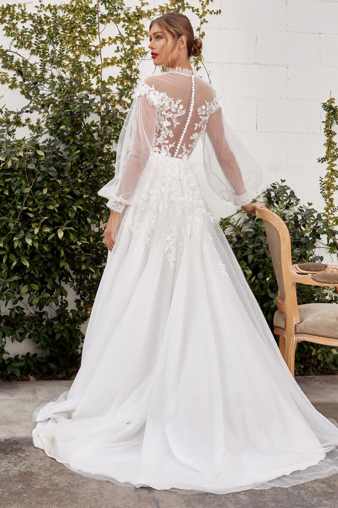 Strike off some bold poses in this beautiful bridal dress. The gorgeous attire is designed in bishop sleeves designed in sheer illusion net fabric and lace applique. The corset bodice has a plunging V-neckline with sheer high neck in pleated details. The A-line tulle silhouette glides gracefully below the waist in a full-length hem and a s