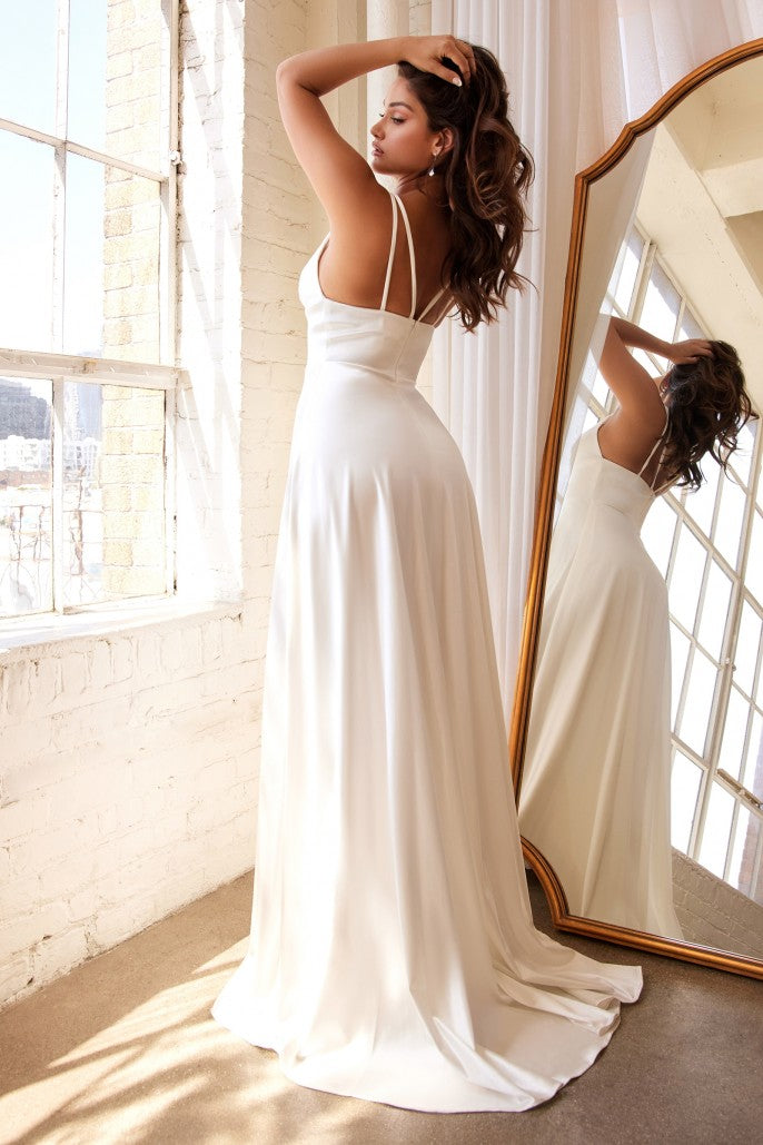 This alluring gown is cut from sumptuous satin, ensuring a fluid drape and clean-lined silhouette. The sweetheart bodice is suspended from slender double straps and the plunging neckline boasts pleats that tuck into a smooth broad waistband and radiate out from center front. A thigh-grazing slit graces the front of the A-line skirt before falling to a pooling hemline.