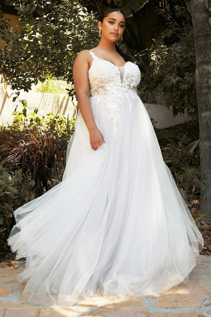 Bring your fairytale wedding to life in this dreamy a-line bridal gown. Cut from layers of luxe tulle this dress features beaded lace appliques and a deep v-neckline. A sheer lace back covers to the mid back. Designer: Cinderellla Divine Material: Tulle Back zipper Fully lined Soft cup inserts