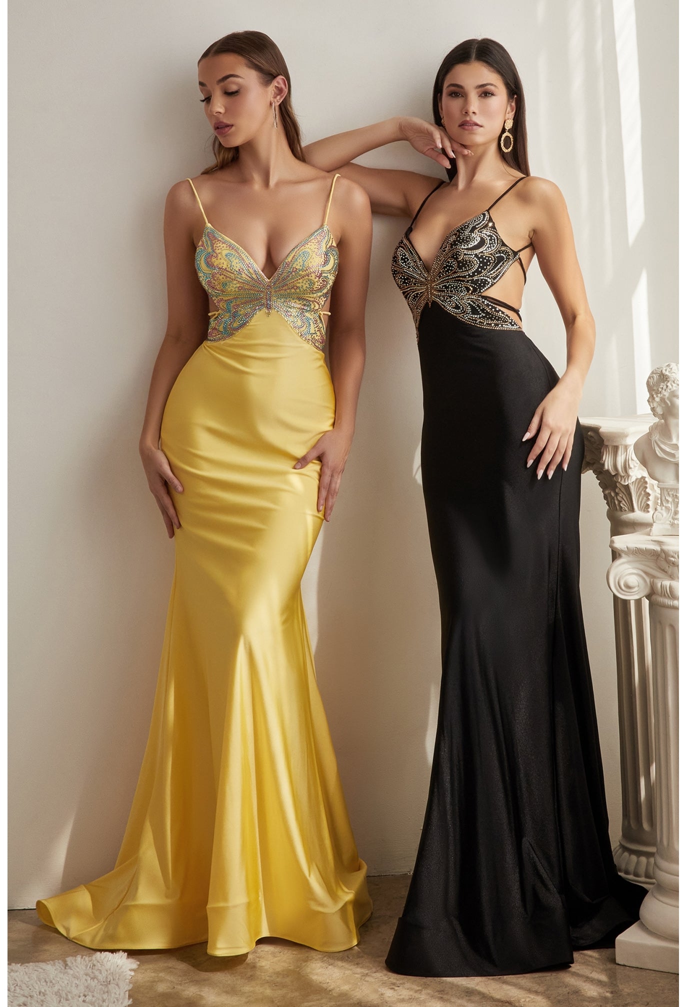 Make a grand entrance to your special occasion in this exquisite mermaid gown! Onlookers will be awestruck by the beautiful stretch satin fabric, which fits snugly across your figure. You’ll turn heads with the playful butterfly motif adorned with glimmering rhinestones. The deep open back has a ruched butt detail plus a criss-cross tie back that adds even more glamor to this eye-catching design. This gown is simply divine, and it is finished with a horsehair hem that radiates elegance.