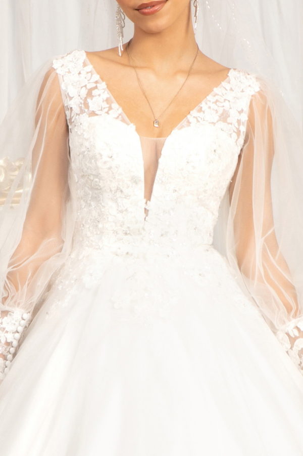 Beads Embellished Long Sleeves Wedding Gown w/ Sheer Back Button Closure Fabric: Lace, Mesh  Length: Long  Neckline: Illusion V-Neck  Sleeve: Long Sleeve  Back: Button Closure, Sheer, Zipper  Embellishment: Beads, Embroidery, Jewel, Sequin  Silhouette: Ball Gown