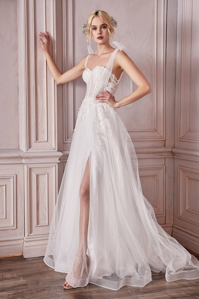 Walk down the aisle in this truly breathtaking bridal gown. Fitted in the bodice a structured corset accentuates modern bust lines. Lace appliques detail the neckline and trickle down the waist. The side seam details a sheer lace with a tulle criss cross strap shaping out to a lace up open back. An A-line silhouette flows out from the waist in layers of luxe tulle and horsehair braid hem.