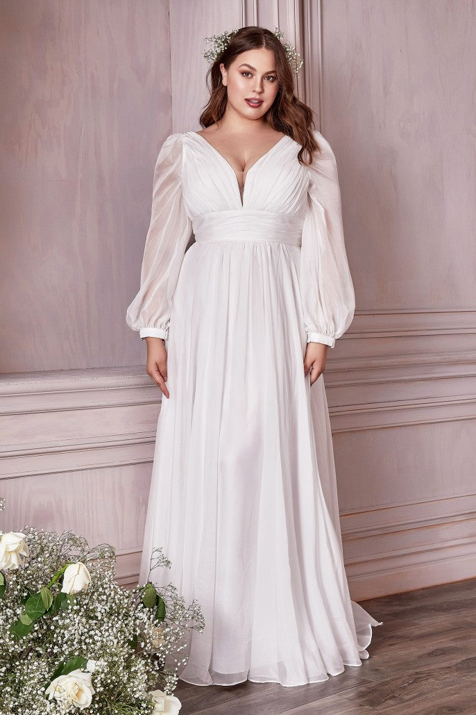 This dreamy chiffon gown features a layered a-line skirt gathered at the waist. Sheer long sleeves drape the arms up to the gathered deep v-neckline bodice and ruched waistband. The back has a mid-opening allowing for bra strap coverage.