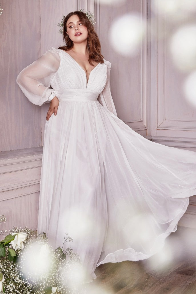 This dreamy chiffon gown features a layered a-line skirt gathered at the waist. Sheer long sleeves drape the arms up to the gathered deep v-neckline bodice and ruched waistband. The back has a mid-opening allowing for bra strap coverage.