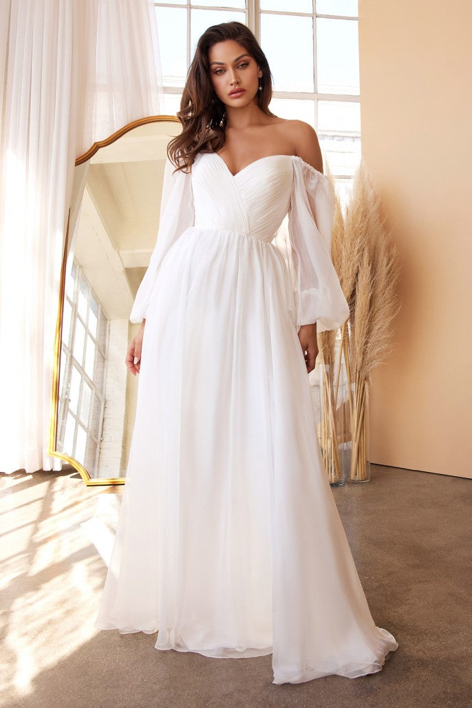 The diaphanous gown features a romantic sweetheart neckline with intricate pleating throughout framed by billowing sheer blouson sleeves that can be worn on or off the shoulder. The frothy A-line skirt is gathered at the waist and flows to a gently pooling hem. Long Sleeve Chiffon Gown (No Stretch) Sweetheart bodice with billowy sleeves Open back Floor length A-line skirt with a small train Details: Bra Cup, Fully Lined Fit: The model is 5'8" and is wearing 4" heels
