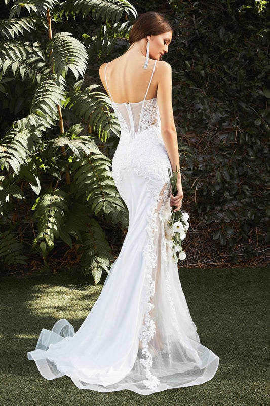 This gorgeous mermaid gown features a corseted sheer tulle bodice with an embroidered lace appliqué that trails down the body and frames the fluted skirt. A tulle overlay reveals a thigh-baring cutaway at the skirt’s underpinning, serving a noteworthy alternative to a classic bridal look.  The bodice’s plunging v-neckline has an illusion mesh insert edged with hand-cut lace. Delicate straps turn to reveal an alluring back bodice design and flattering basque waistline.