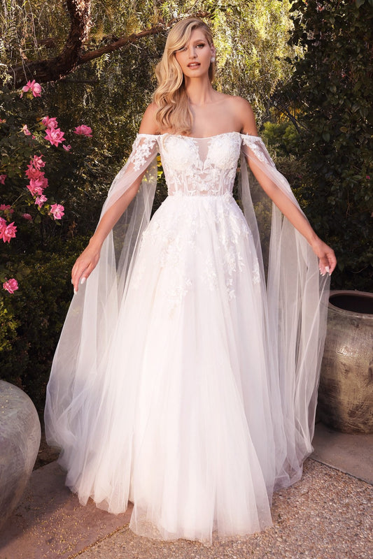 This diaphanous gown features a sheer strapless bodice and frothy A-line skirt cut from layers of soft tulle to a floor-sweeping hem. The bodice has supportive internal boning to ensure it stays in place and is framed by elongated tulle sleeves split along the inseam, falling to meet the hem of the skirt and conjuring up an ethereal mood. Hand cut degrade lace placements flower about with pearlescent beaded accents.