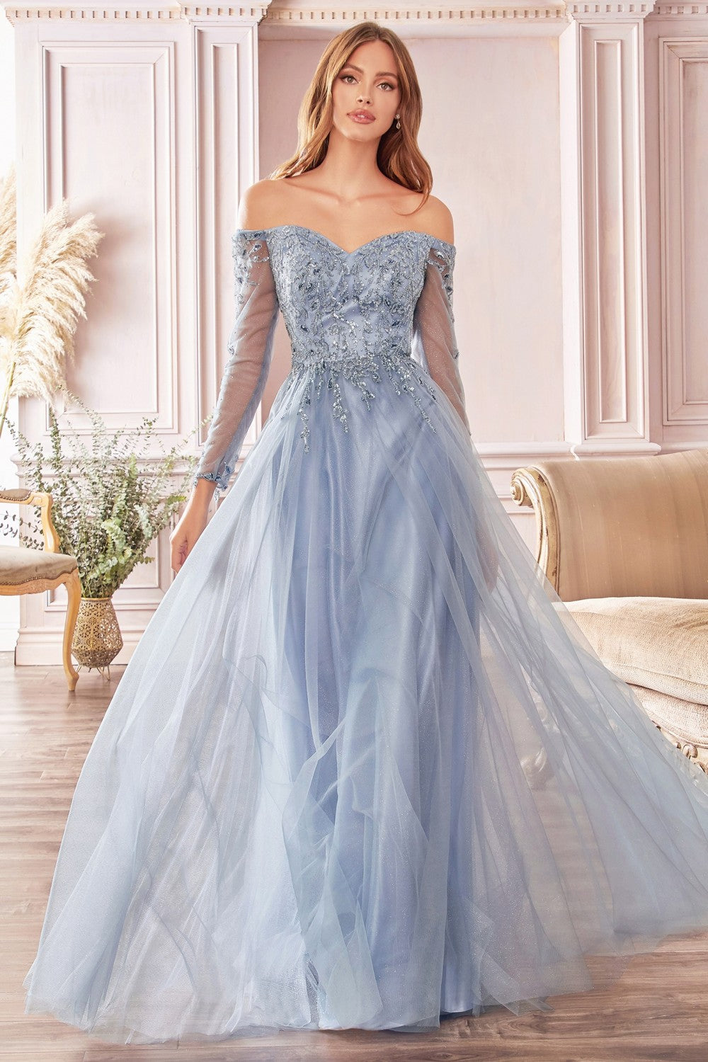 Captivate the room in this smoky-blue beaded long off the shoulder A-line glitter tulle dress with sheer 3/4 sleeves and A-line skirt. A-line off the shoulder layered glitter tulle gown with floral beaded bodice Off the shoulder sweetheart bodice with illusion 3/4 sleeves Open back Floor length A-line skirt Details: Bra
