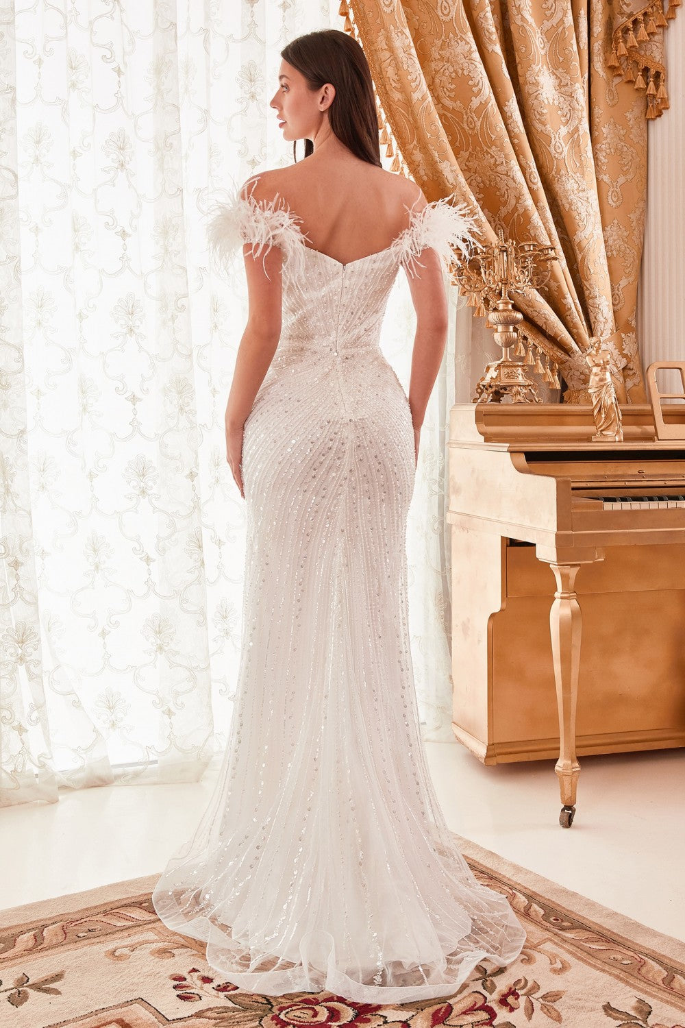 This stunning gown from Ladivine by Cinderella Divine makes an unforgettable entrance. Crafted from sequins and feathers, the off-the-shoulder design adds allure for any special occasion.