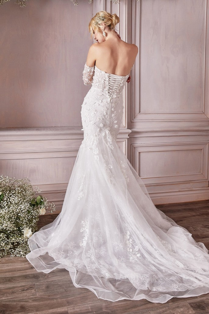 Prepare to meet the bridal gown of your dreams. This breathtaking strapless mermaid gown is cut from a delicate chantilly lace and layered with flowing tulle adorned with three dimensional floral appliques. The fitted bust is designed with a plunging v-neckline and lace up corset back for a custom fit. Off the shoulder long lace sleeves are detachable at the underarm for a transitional look.