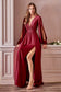 Elegance and beauty, this soft satin gown features a long blouson sleeve, pleated wrap around bodice and deep V-neckline. The A-line skirt features a high slit for added elegance.  Satin Deep V-neckline Split blouson sleeves  Open V-back Bra cup, fully lined