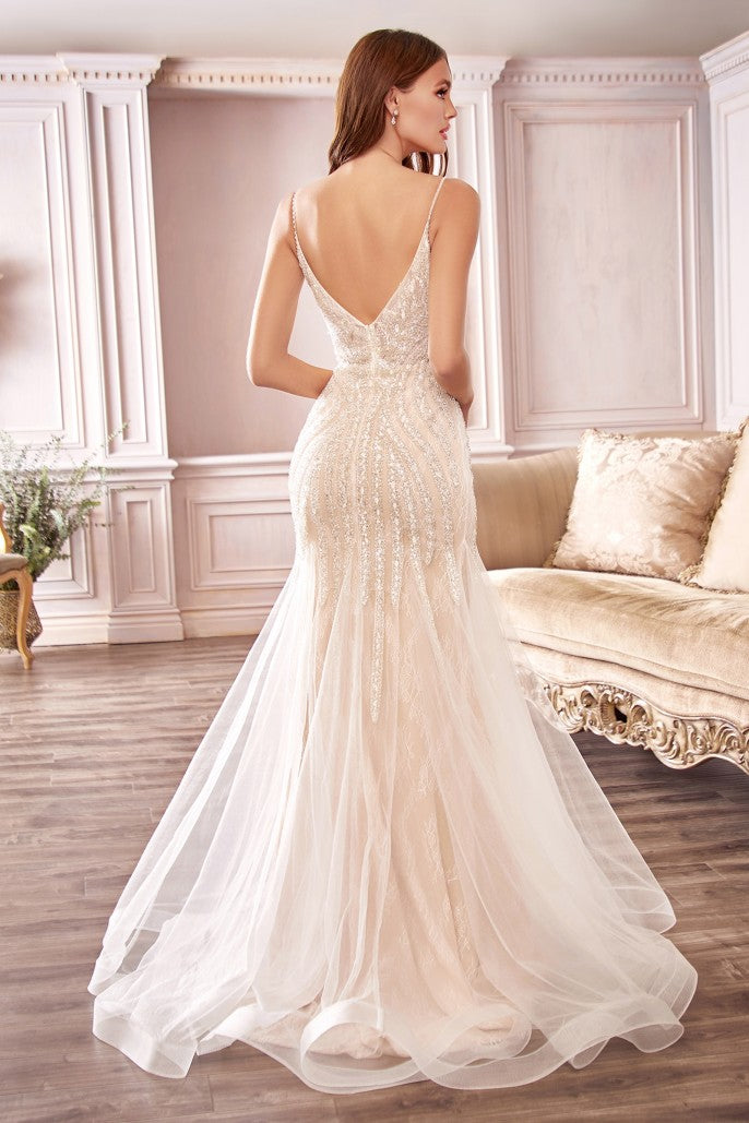 This impeccably crafted gown will accentuate your hourglass shape with a dramatic floor-sweeping mermaid skirt. Sheer layered tulle and chantilly lace is embellished with beading that shimmers as you move. The dress features a deep illusion v-neckline that turns to reveal a low open back, delicately suspended by beaded spaghetti straps. The dress is lined with stretch lining for the wearer's comfort.
