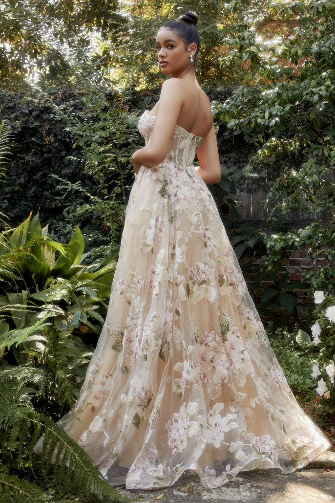 Step into a beautiful fairy tale garden when you slip into this ravishing magnolia print strapless a-line gown. The sheer boned bodice and sweetheart neckline are divinely crafted to add delicate femininity to your look. The lightweight organza fabric of this dress is adorned with an enchanting magnolia print. This ultra-romantic silhouette will ensure all eyes are on you as you make your way through the party or down the aisle! Enchant everyone with exquisite beauty in this gorgeous gown.