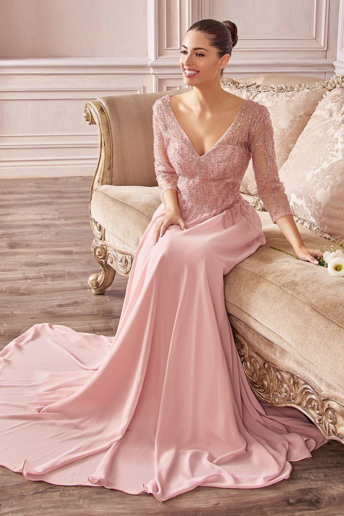 Beautiful, timeless flowing chiffon a-line gown with three-quarter sleeves and trickle embellished bodice.  Chiffon  V-neck bodice Details: Bra Cup, Fully Lined Illusion 3/4 sleeves  Open back Dry Clean Suggested 