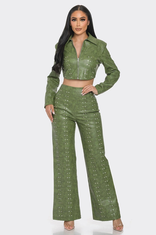 Olive color faux leather set with rhinestone. Featuring a long sleeve cropped front zipper jacket with padded shoulders embellished with rhinestones and textured print. The rhinestone embellished pants are wide leg and high waisted with a back zipper. 50% Polyester 50% Polyurethane 