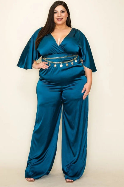 Teal color. Satin wrap front short sleeve smocked waist jumpsuit with chain belt.                              97% Polyester 3 % Spandex.