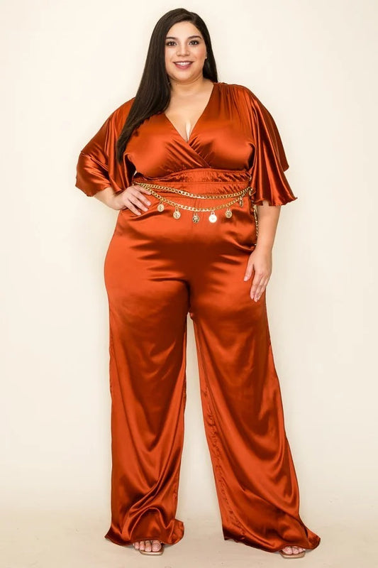 Cognac color.Satin wrap front short sleeve smocked waist jumpsuit with chain belt.                              97% Polyester 3 % Spandex 