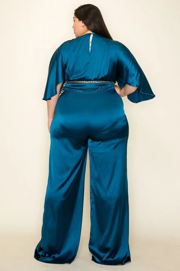 Teal color. Satin wrap front short sleeve smocked waist jumpsuit with chain belt.                              97% Polyester 3 % Spandex.