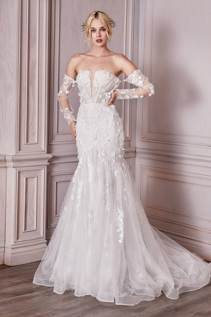 Prepare to meet the bridal gown of your dreams. This breathtaking strapless mermaid gown is cut from a delicate chantilly lace and layered with flowing tulle adorned with three dimensional floral appliques. The fitted bust is designed with a plunging v-neckline and lace up corset back for a custom fit. Off the shoulder long lace sleeves are detachable at the underarm for a transitional look.