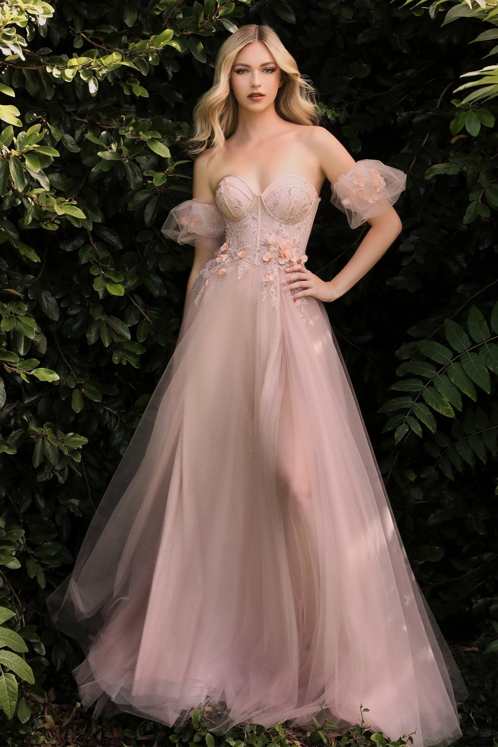 Runaway to the secret garden in this whimsical ball gown. Layered in luminescent luxe tulle this a-line is blossoming with floral appliques. The strapless structured bodice sits on the waistline attaching to optional off the shoulder puff sleeves.