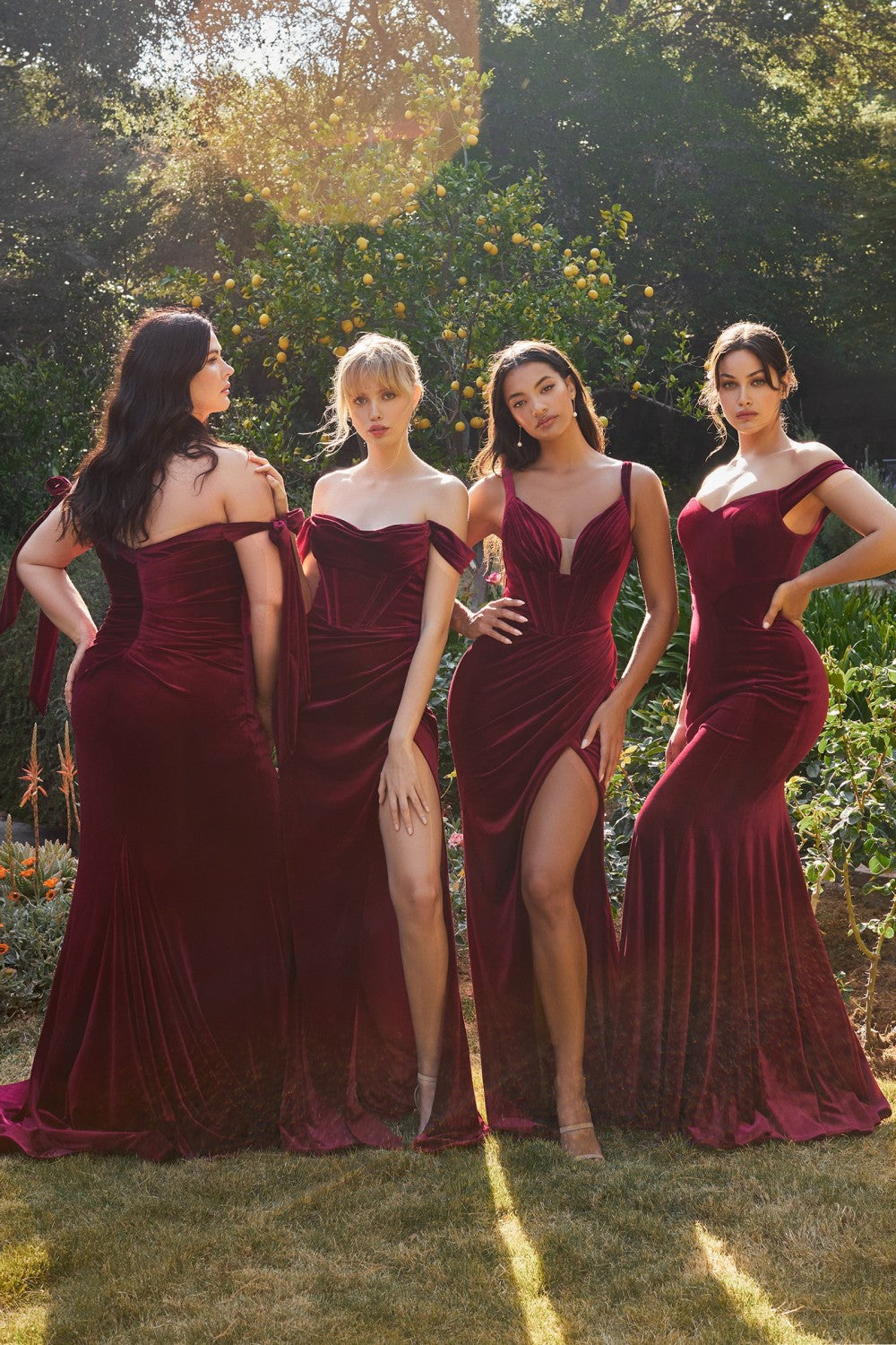 Burgundy color made from a luxurious stretch velvet, this regal gown can be incorporated into any bridal party or next evening event. A soft sweetheart neckline allows for the off shoulder straps to drape from the upper arm. The hourglass silhouette fits like a glove through the body before flaring out at the knee.