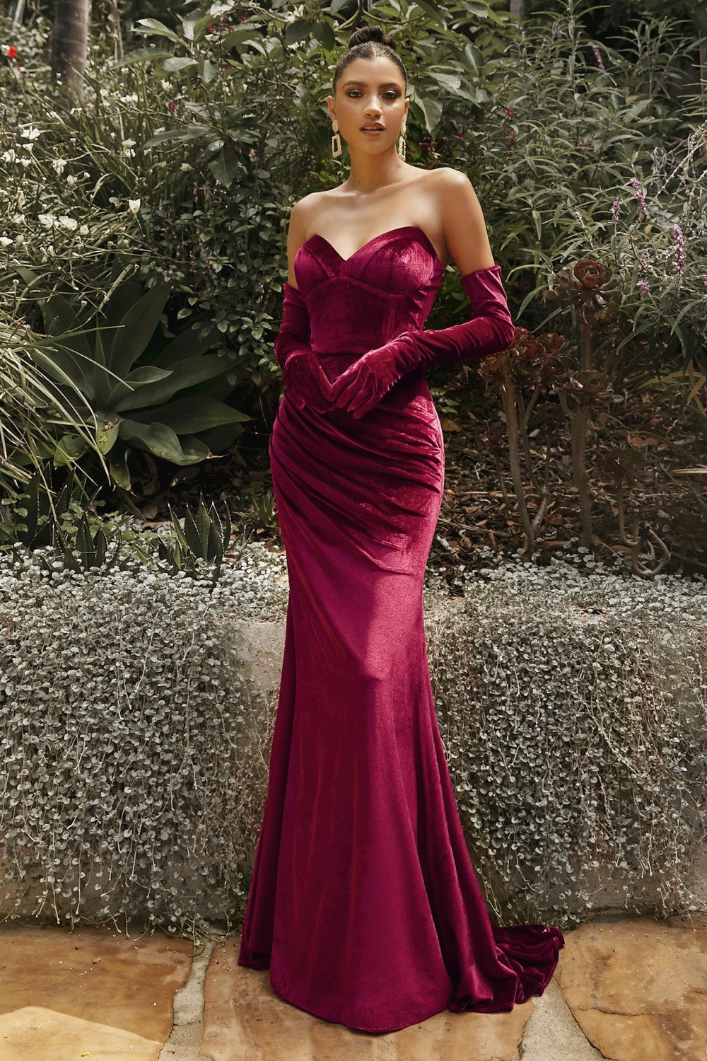 A vintage take on classic glamour, Ch176 captures the feel of old Hollywood with the refreshing energy of the modern era. This luxe design features a corset-inspired bodice with a mermaid skirt in velvet fabrication. Adorned with jewel tones, it comes with detachable gloves for a versatile and dramatic appeal.